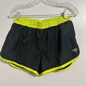 Umbro black shorts with a yellowish green trim size M
